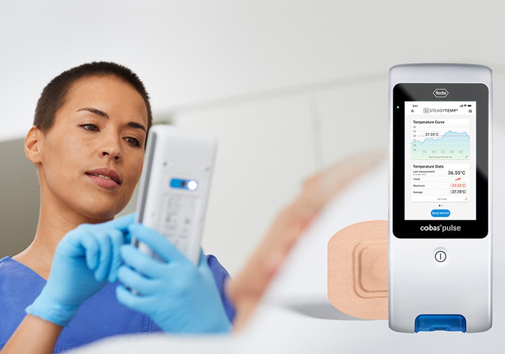 A doctor is looking at a temperature curve on the cobas® pulse device